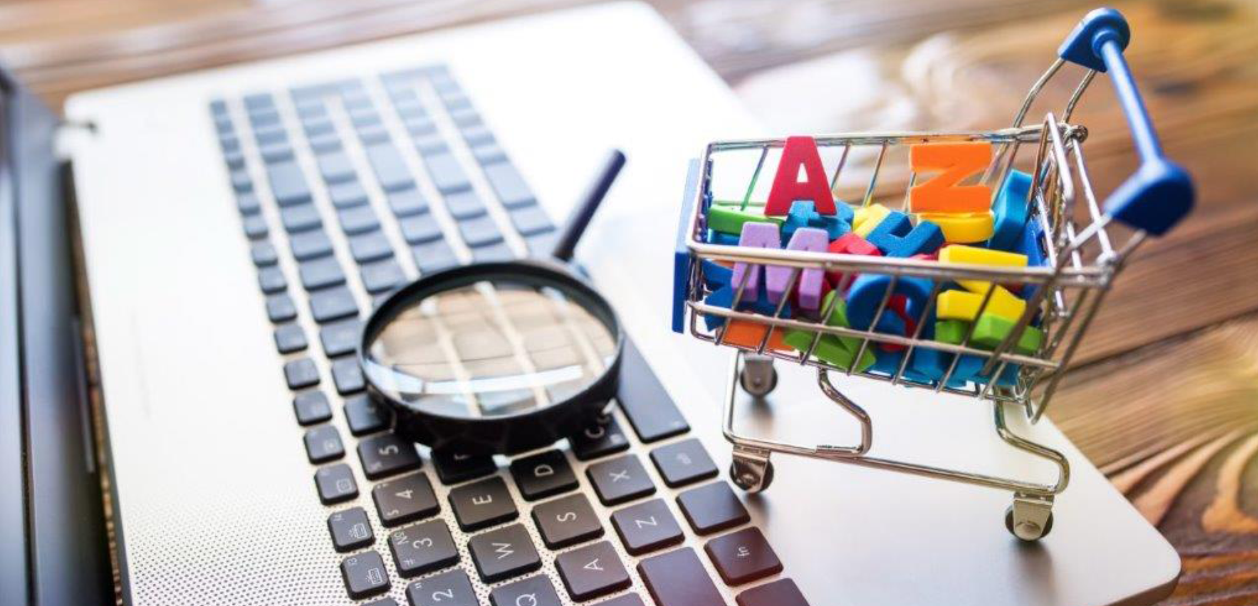 shopping-cart-alphabet-magnifying-glass-search-laptop